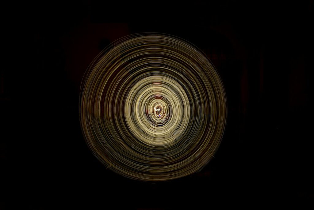 a black background with a circular design in the center