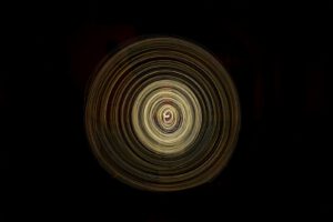 a black background with a circular design in the center